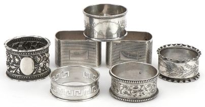 Seven Victorian and later silver napkin rings, various hallmarks, the largest 4.8cm wide, total