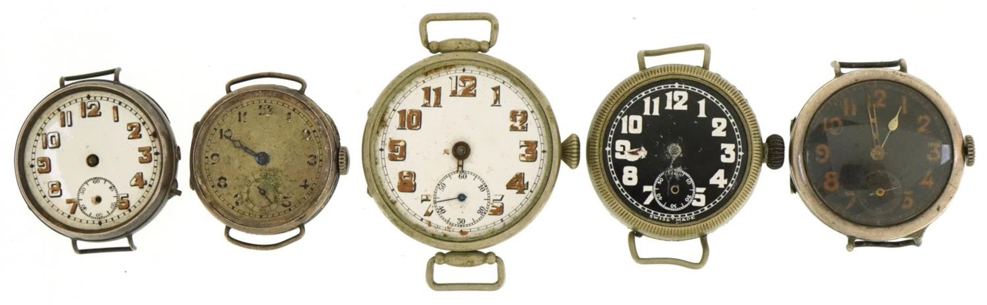 Five military interest trench style wristwatches, two silver, one engraved 24716 R, the largest 37mm