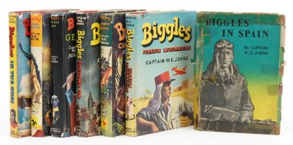 Seven Biggles hardback books with dust jackets by Captain W E Johns including Biggles Gets his