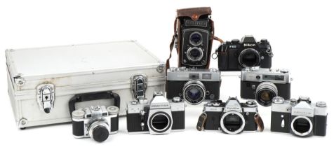 Vintage cameras including Yashica Lynx 5000E, Paxette, Konica Auto S2, Nikon F-301 and Walzflex :