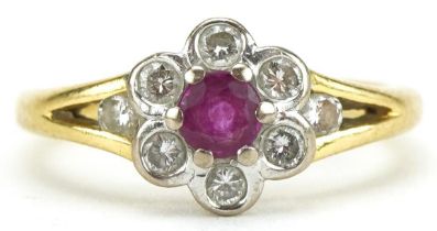 18ct gold ruby and diamond flower head ring, the ruby approximately 3.50mm in diameter, size H, 2.8g