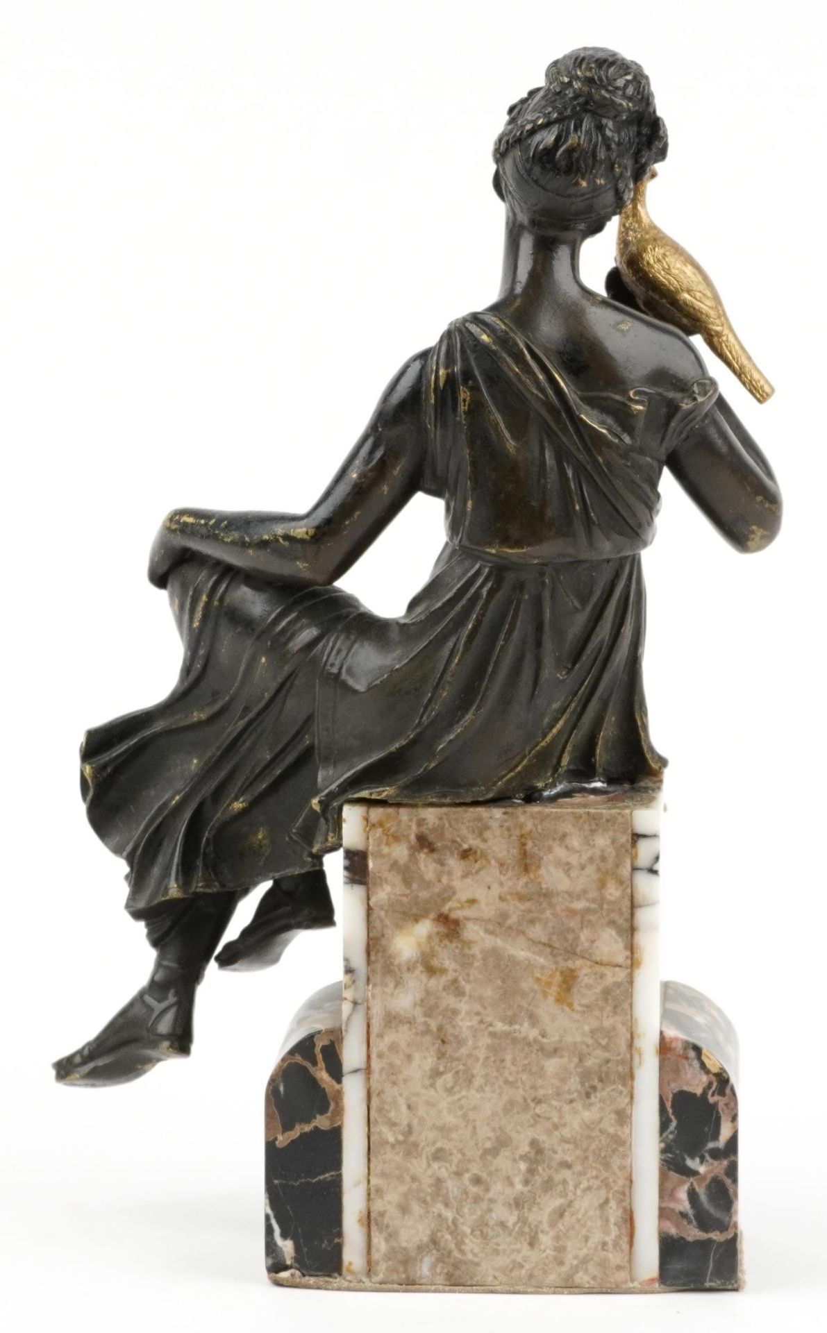 Classical partially gilt patinated bronze figure of a female holding a bird raised on a marble base, - Image 2 of 3