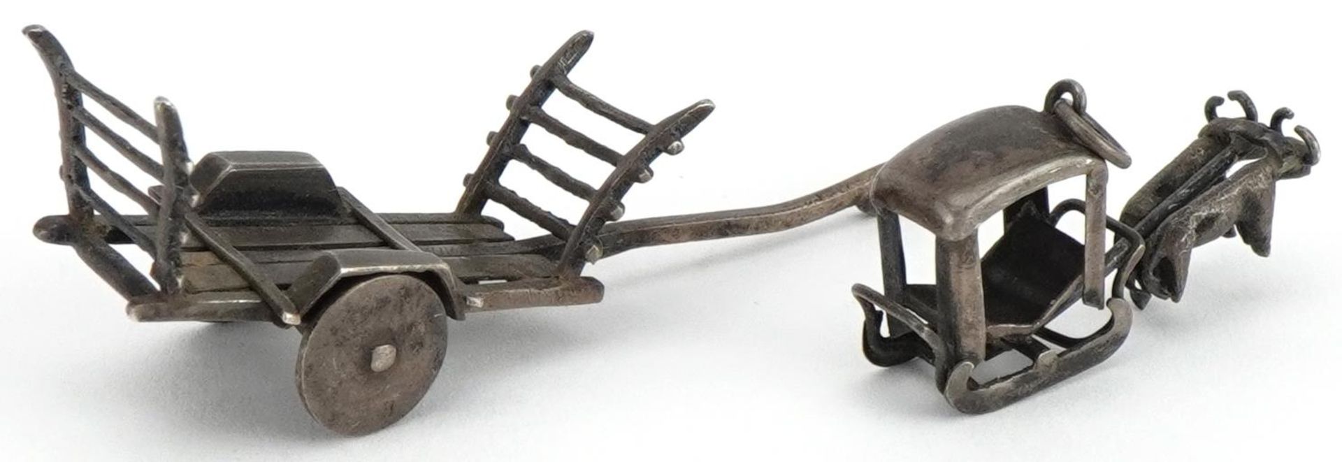 Asian unmarked silver miniature cart and a buffalo drawn cart charm, the largest 5.5cm in length, - Bild 2 aus 3