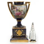 Vienna, Austrian miniature porcelain figure of a female Pierrot and an urn vase hand painted with