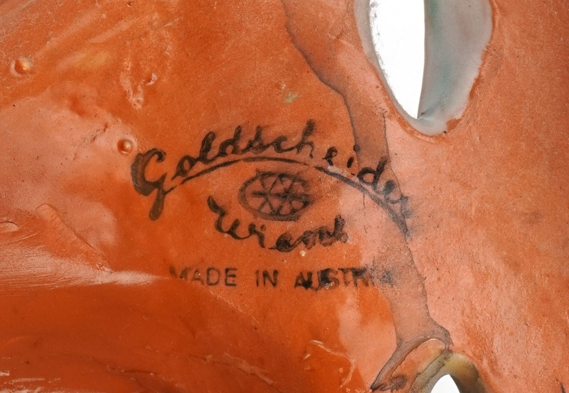 Goldschneider, Austrian Art Deco pottery facemask of a female holding a mask, factory stamp and - Image 3 of 3