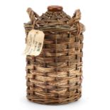 Royal Navy issue 4.5 litre flagon of Pusser's rum with wicker casing and label : For further