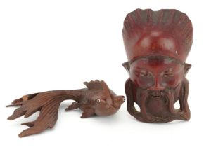 Japanese carved wooden Koi carp with beaded glass eyes together with a carved wooden face mask,