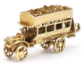 9ct gold vintage open top bus charm, 3cm in length, 4.7g : For further information on this lot