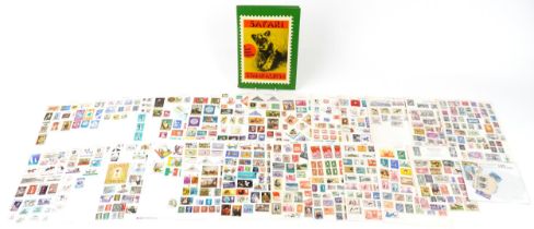 Collection of British and world stamps arranged on sheets and in an album : For further