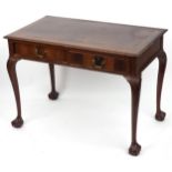 Edwardian mahogany writing table with two frieze drawers on ball and claw feet, 77cm H x 107cm W x