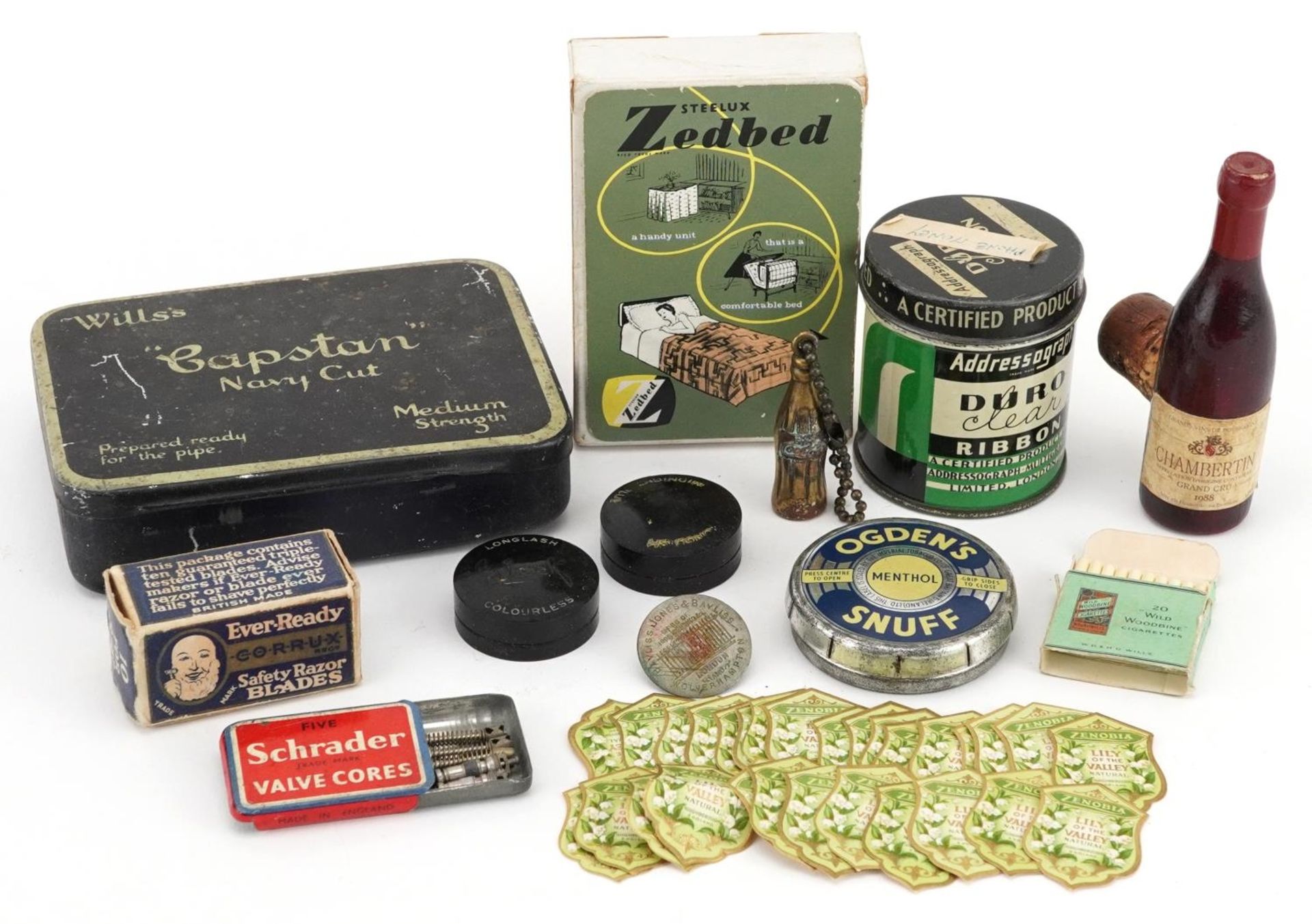 Advertising items including Ogden's Snuff tin, Coca Cola bottle, Eveready Shaving razor blades,