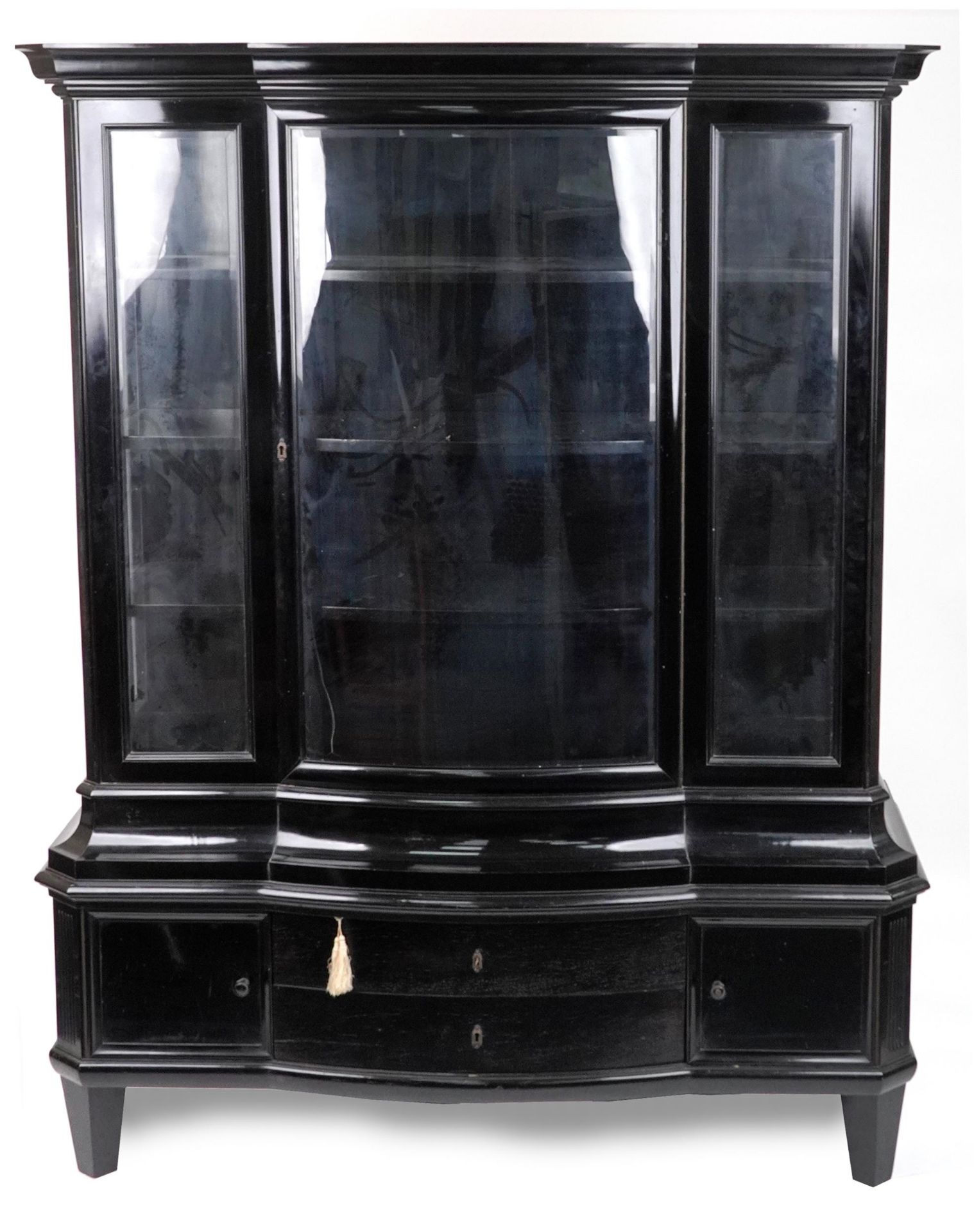 19th century European ebonised bow front display cabinet with bevelled glass panels, on tapering
