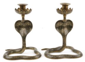 Pair of Indian brass enamelled candlesticks engraved with flowers in the form of serpents, each 21.