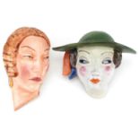 Two Art Deco female facemasks comprising one attributed to Goldschneider and a Czechoslovakian