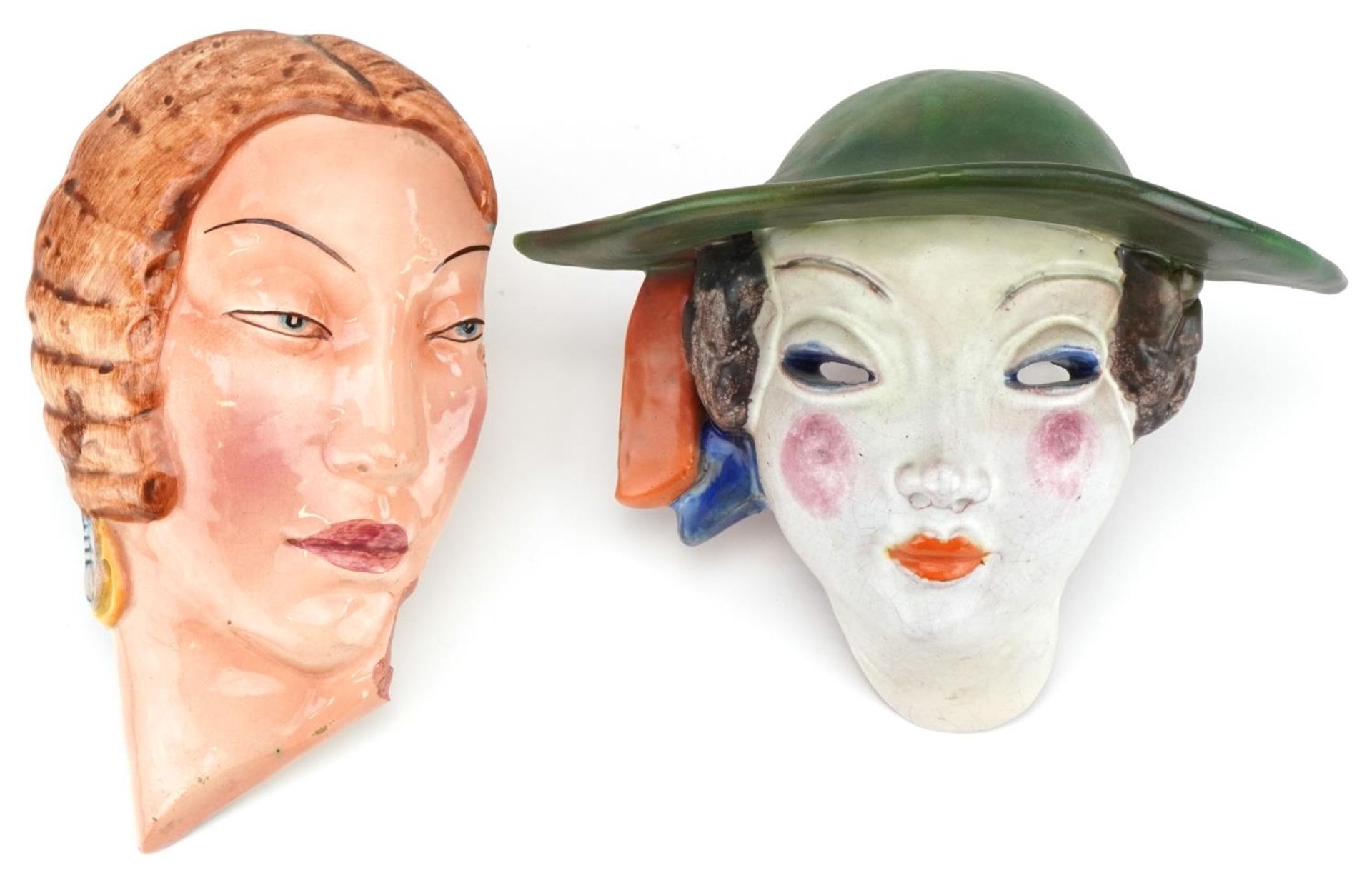 Two Art Deco female facemasks comprising one attributed to Goldschneider and a Czechoslovakian