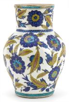 Islamic pottery vase hand painted with stylised flowers and foliage, 28cm high : For further