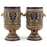 Royal Doulton, pair of Victorian salt glazed stoneware barrels with animalia handles decorated in