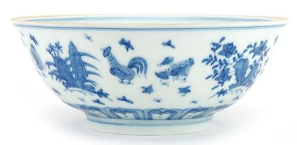 Chinese blue and white porcelain bowl hand painted with chickens in a landscape, six figure