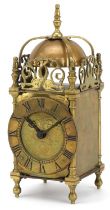 18th century style brass lantern clock having a circular dial with Roman numerals, 25.5cm high : For