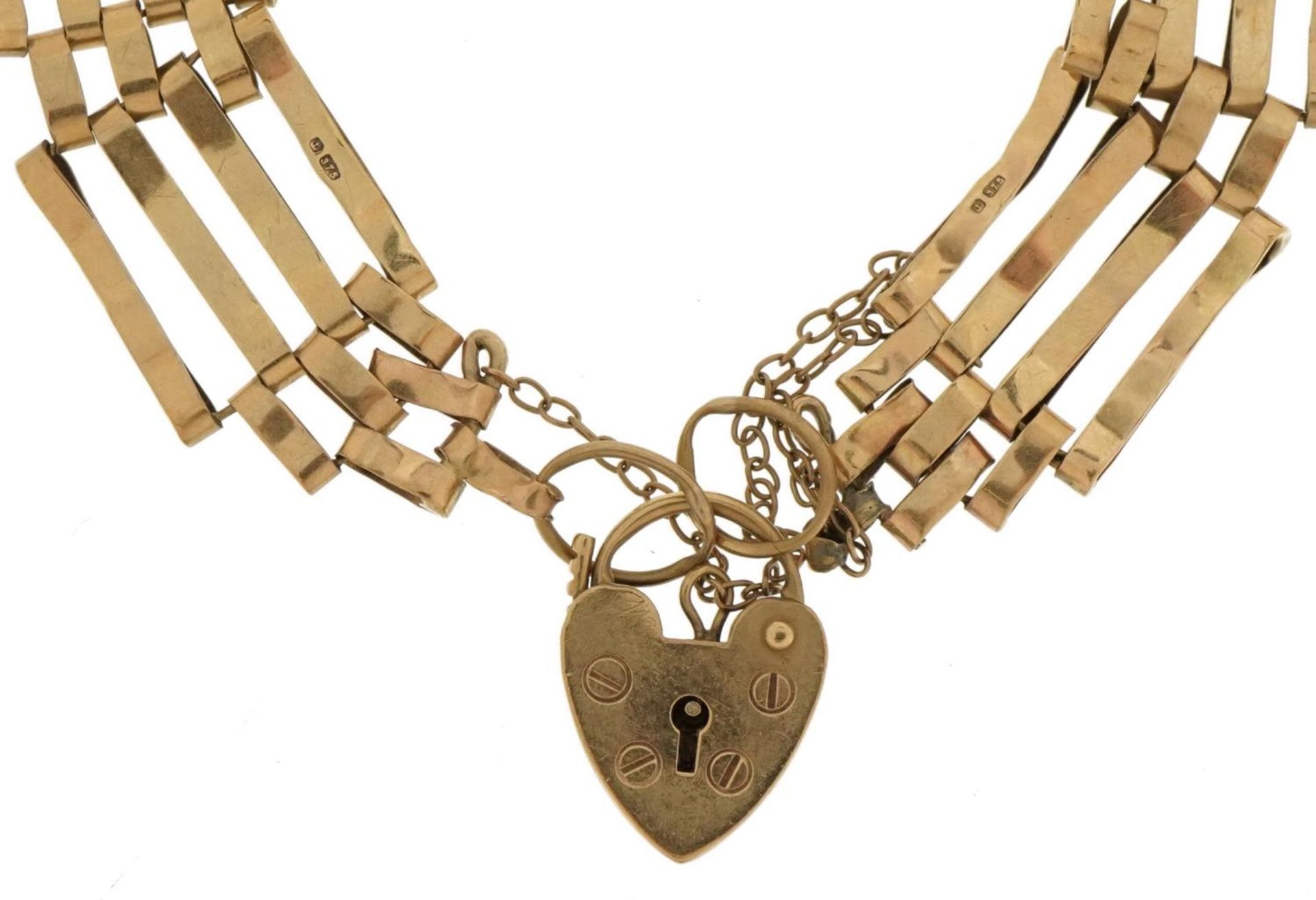 9ct gold four row gate bracelet with 9ct gold love heart padlock, 18cm in length, 8.5g : For further