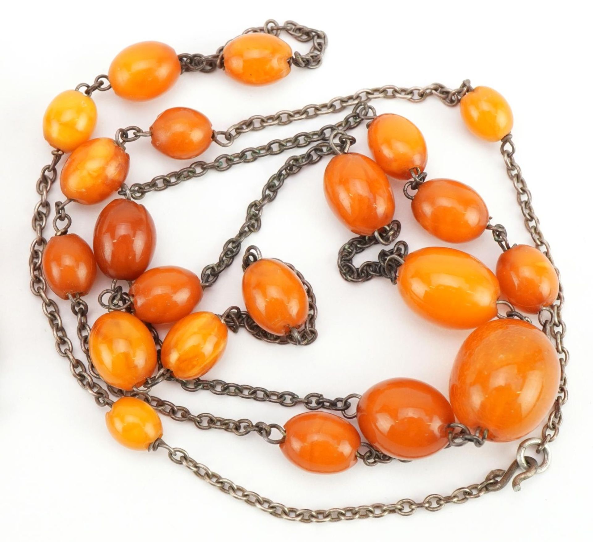 Two butterscotch amber coloured bead necklaces, one with white metal chain, the largest 46cm in - Image 3 of 3
