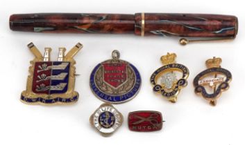 Parker marbleised fountain pen with gold nib, five pin badges and a Universal Pictures admission