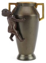 Aesthetic style bronzed vase with twin handles surmounted with a nude bronze child, 16cm high :