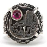 Persian silver ring set with a cabochon ruby and cast with calligraphy and motifs, size O/P, 16.8g :