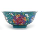 Chinese Tibetan porcelain turquoise ground footed bowl hand painted with flower heads amongst