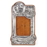 Roberts & Belk Ltd, Art Nouveau style silver easel photo frame embossed with Jack Frost and moon