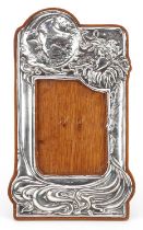 Roberts & Belk Ltd, Art Nouveau style silver easel photo frame embossed with Jack Frost and moon