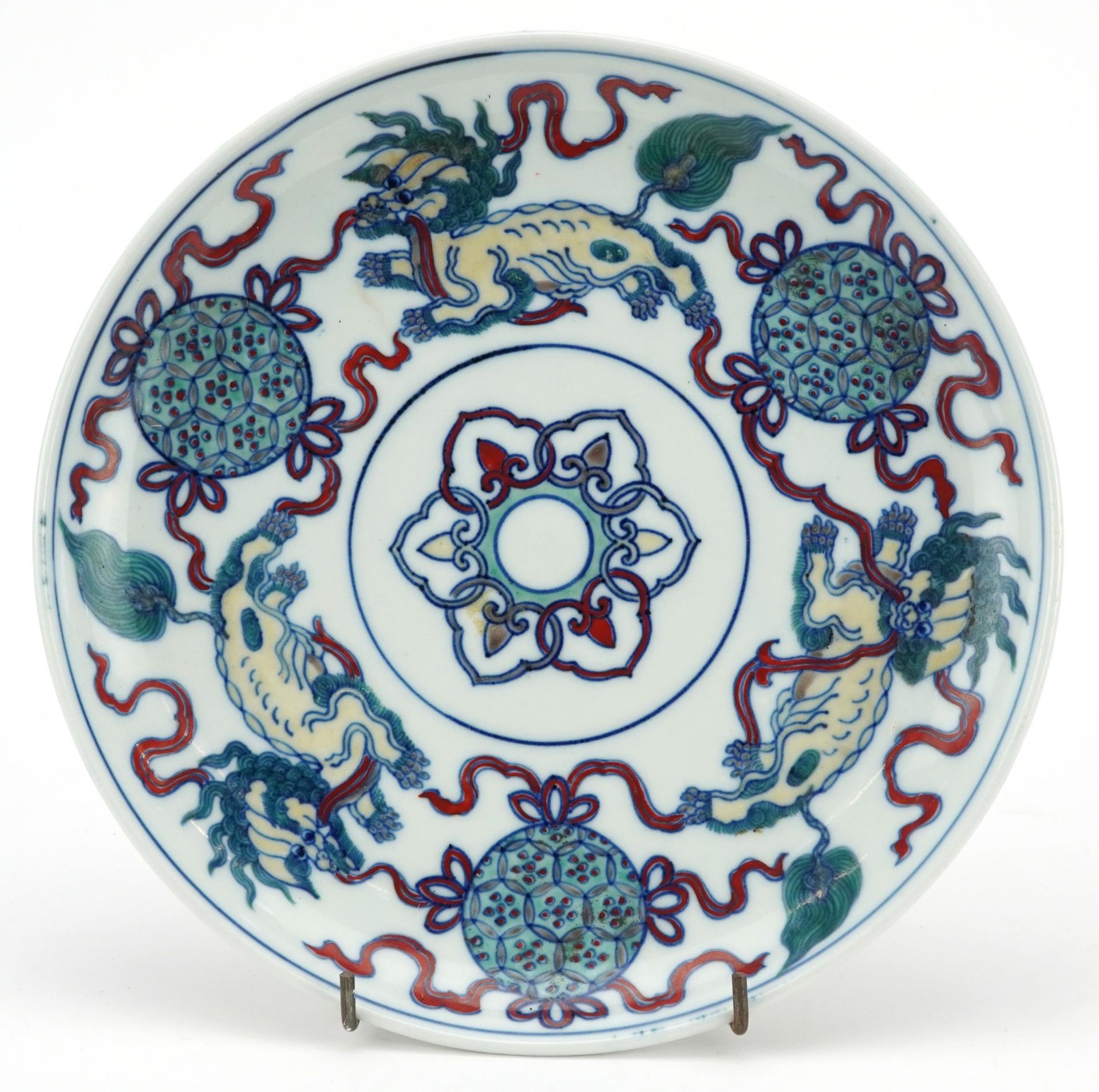 Chinese porcelain doucai dish hand painted with qilins, six figure character marks to the reverse,