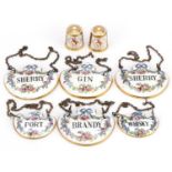 Six Crown Staffordshire decanter labels and two Royal Crown Derby thimbles, the largest each 5cm