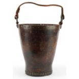 19th century military interest metal studded leather fire bucket impressed WD 64, 31cm high