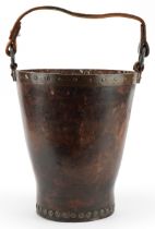 19th century military interest metal studded leather fire bucket impressed WD 64, 31cm high