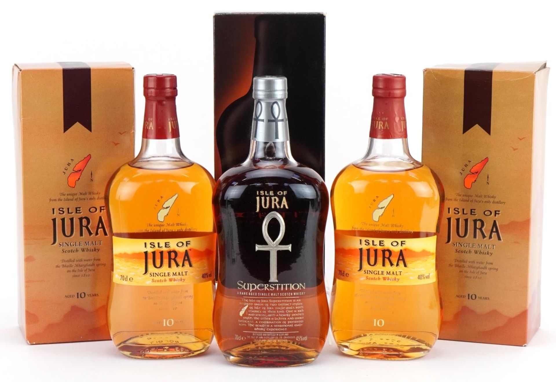Three bottles of Iles of Jura whisky with boxes comprising two bottles aged 10 years and Rare Aged