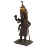 19th century partially gilt patinated bronze table vesta in the form of a pedlar, 19cm high : For