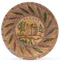 19th century earthenware plate with glazed Adam & Eve incised decoration, 34cm in diameter : For