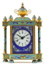 French style champleve enamel brass mantle clock with enamelled face having circular dial with Roman