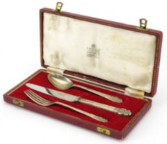Garrard & Co, Elizabeth II silver three piece christening set housed in a Garrard & Co fitted