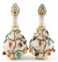 Meissen, large pair of 19th century German floral encrusted bottles with stoppers decorated in
