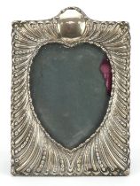 William Comyns & Sons, Victorian silver embossed photo frame with heart aperture, London 1896, 18.
