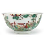 Chinese porcelain bowl hand painted in the famille verte palette with children playing in a palace
