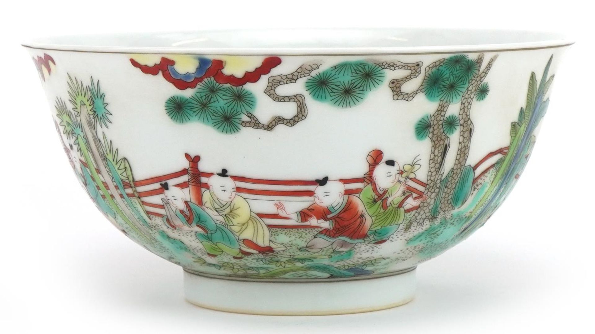 Chinese porcelain bowl hand painted in the famille verte palette with children playing in a palace