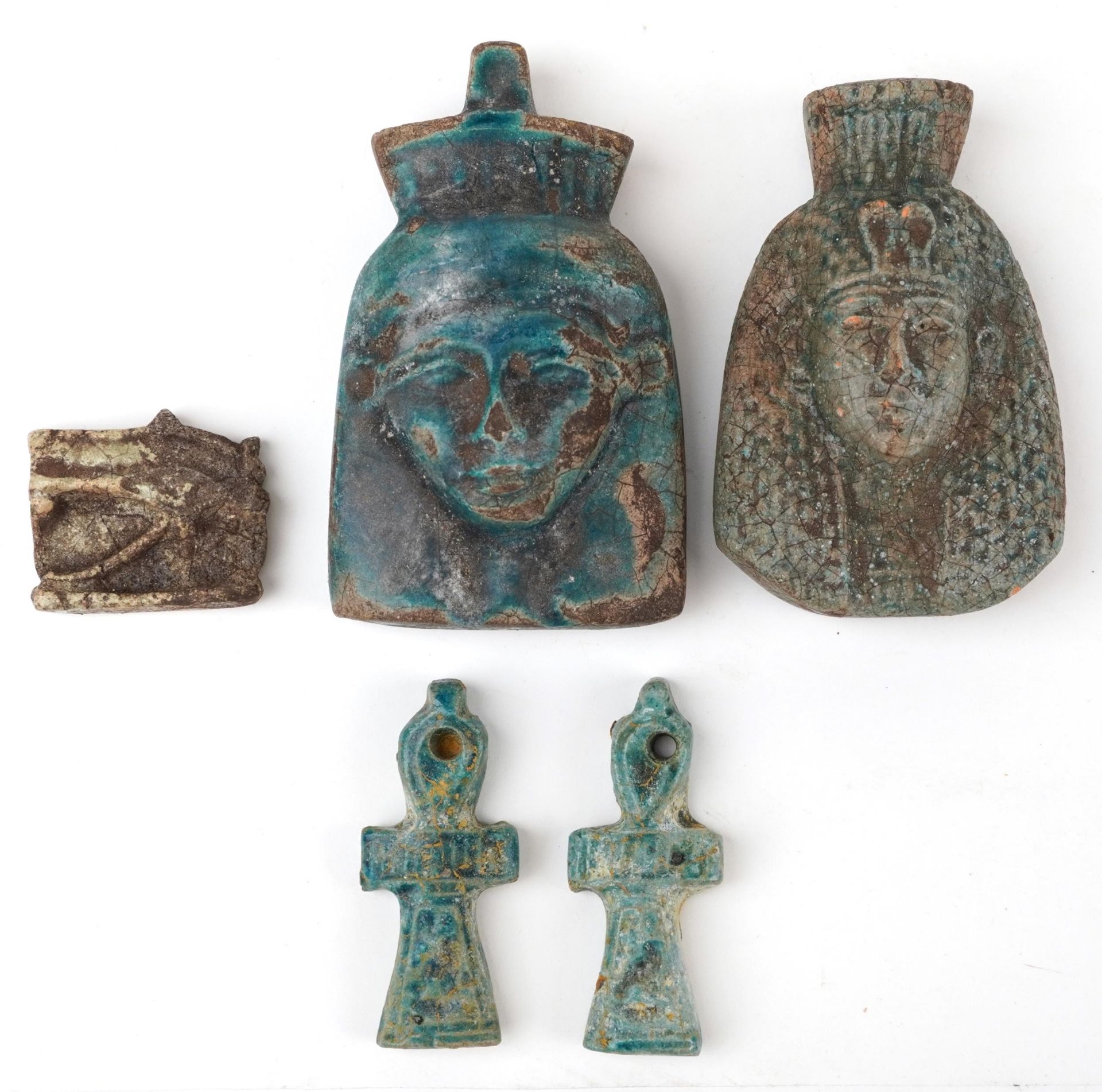 Two Egyptian style faience glazed amulets and three others, the largest 11cm high : For further