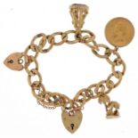 9ct gold charm bracelet with three gold charms and two 9ct gold love heart padlocks including a