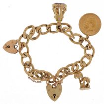 9ct gold charm bracelet with three gold charms and two 9ct gold love heart padlocks including a