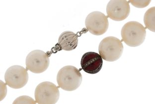 Cultured pearl necklace with red enamel spacers set with diamonds and 18ct white gold ball clasp,