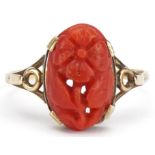 Unmarked gold coral ring carved with a flower, with pierced shoulders, size S/T, 2.2g