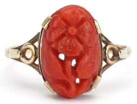 Unmarked gold coral ring carved with a flower, with pierced shoulders, size S/T, 2.2g
